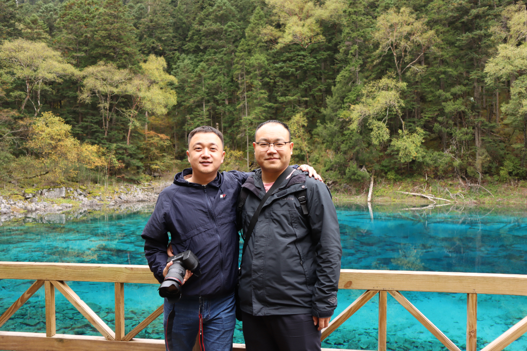 The company organized a trip to Jiuzhaigou. ... cover